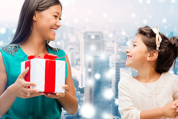 Image showing happy mother and little girl with gift box