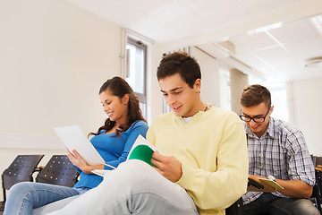 Image showing group of smiling students in lecture hall