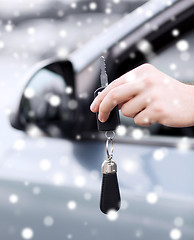 Image showing close up of man with car key outdoors