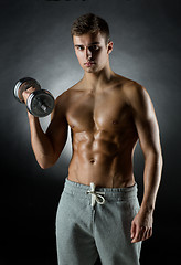 Image showing young man with dumbbell