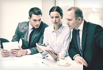 Image showing business team with tablet pc having discussion