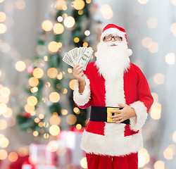 Image showing man in costume of santa claus with dollar money