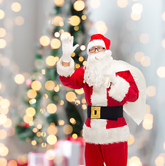 Image showing man in costume of santa claus with bag