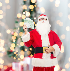 Image showing man in costume of santa claus with euro money