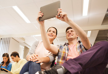 Image showing group of smiling students with tablet pc