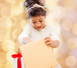 Image showing smiling little girl with gift box