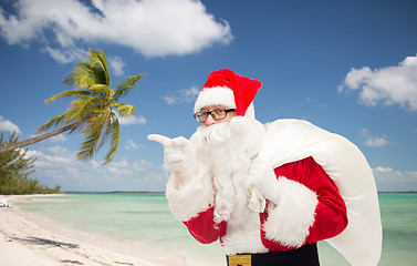 Image showing man in costume of santa claus with bag