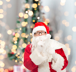 Image showing man in costume of santa claus with bag