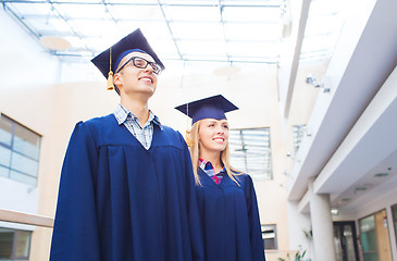 Image showing group of smiling students in mortarboards