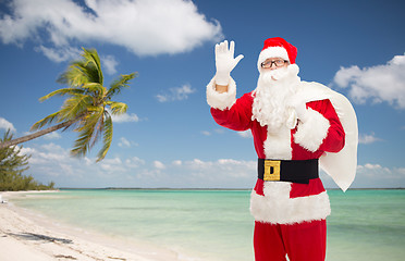 Image showing man in costume of santa claus with bag