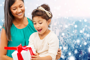 Image showing happy mother and little girl with gift box