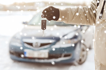 Image showing close up of man with car key outdoors