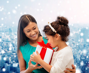 Image showing happy mother and little girl with gift box