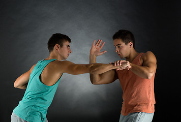 Image showing young men wrestling