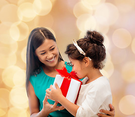 Image showing happy mother and little girl with gift box