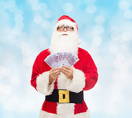 Image showing man in costume of santa claus with euro money