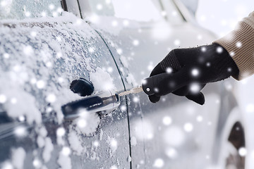 Image showing close up of man with car key outdoors