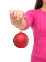 Image showing close up of woman in sweater with christmas ball