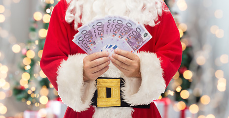 Image showing close up of santa claus with euro money