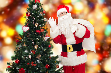 Image showing santa claus with bag and christmas tree