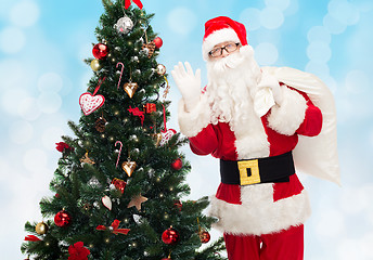 Image showing santa claus with bag and christmas tree