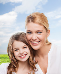 Image showing smiling mother and little girl