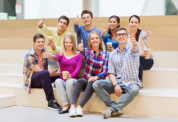 Image showing group of smiling students with paper coffee cups