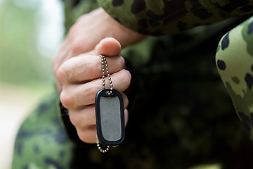 Image showing close up of young soldier in military uniform