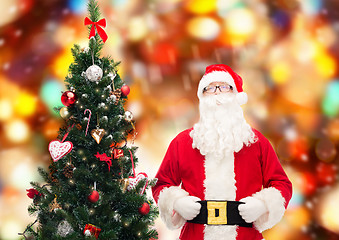 Image showing man in costume of santa claus with christmas tree