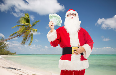 Image showing man in costume of santa claus with euro money