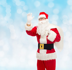 Image showing man in costume of santa claus with bag