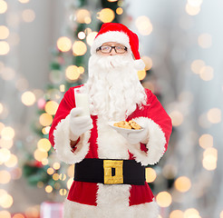 Image showing santa claus with glass of milk and cookies