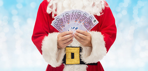 Image showing close up of santa claus with euro money