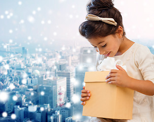 Image showing smiling little girl with gift box