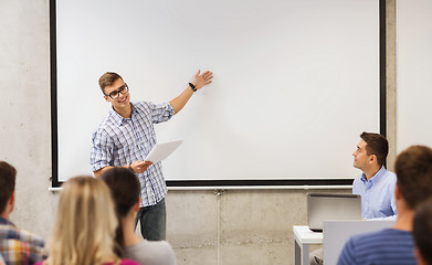 Image showing group of students and teacher in classroom