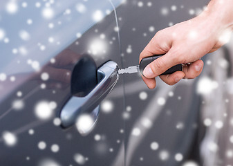 Image showing close up of man with car key outdoors