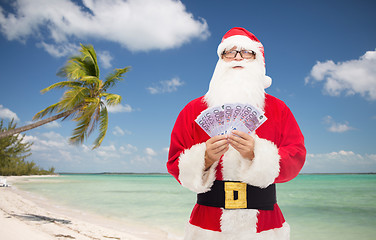 Image showing man in costume of santa claus with euro money