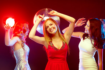 Image showing three smiling women dancing in the club