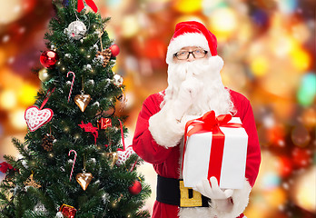 Image showing man in costume of santa claus with gift box