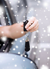 Image showing close up of man with car key outdoors