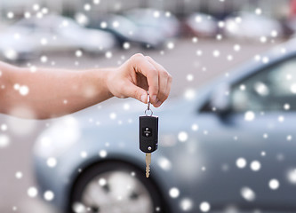 Image showing close up of man with car key outdoors