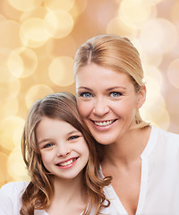 Image showing smiling mother and little girl