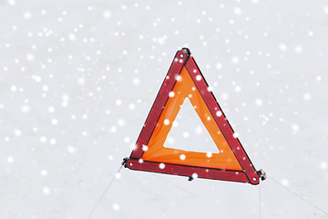 Image showing closeup of warning triangle on snow