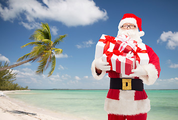 Image showing man in costume of santa claus with gift boxes