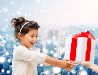 Image showing smiling little girl with gift box