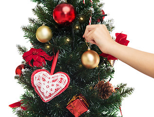Image showing close up of woman with christmas tree decoration
