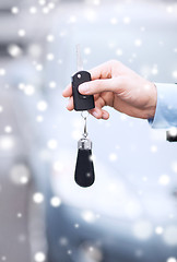 Image showing close up of man with car key outdoors