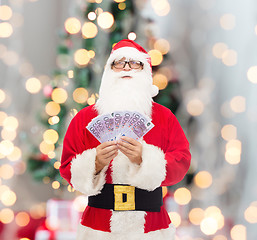 Image showing man in costume of santa claus with euro money