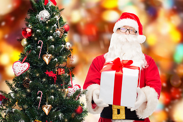 Image showing man in costume of santa claus with gift box