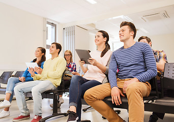 Image showing group of smiling students with tablet pc